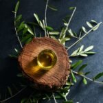 brown round wooden ornament on green leaves