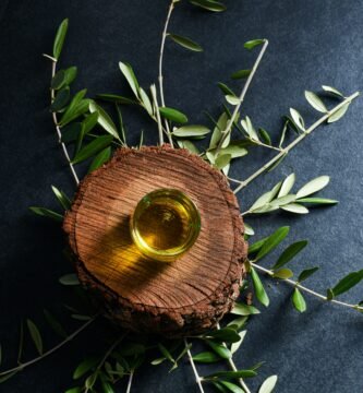 brown round wooden ornament on green leaves