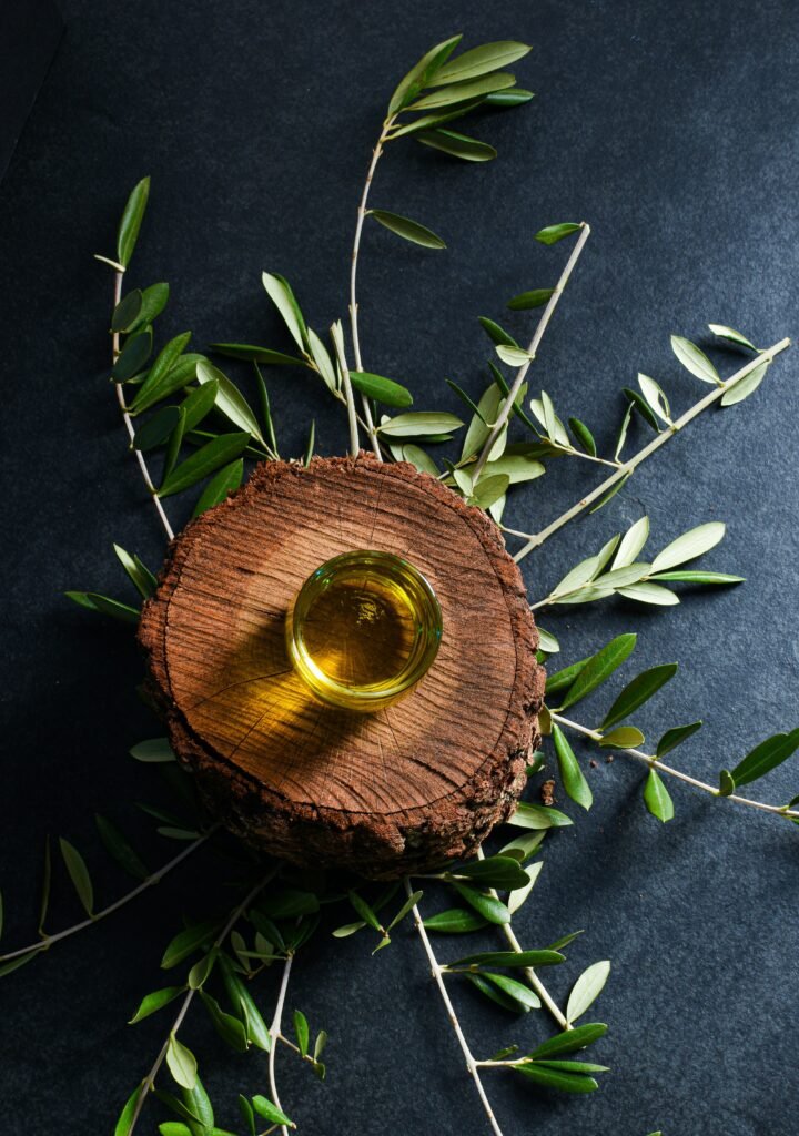 brown round wooden ornament on green leaves